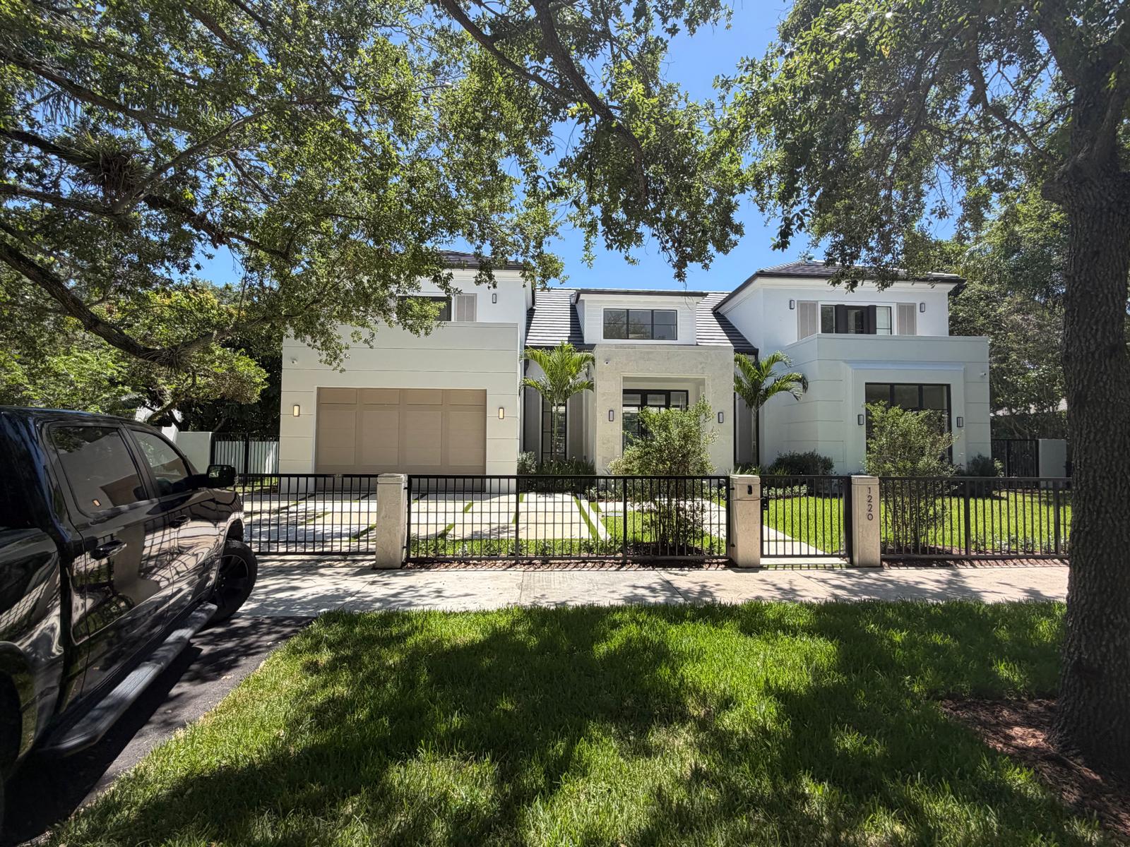 Completed custom home by Moura General Construction — front elevation