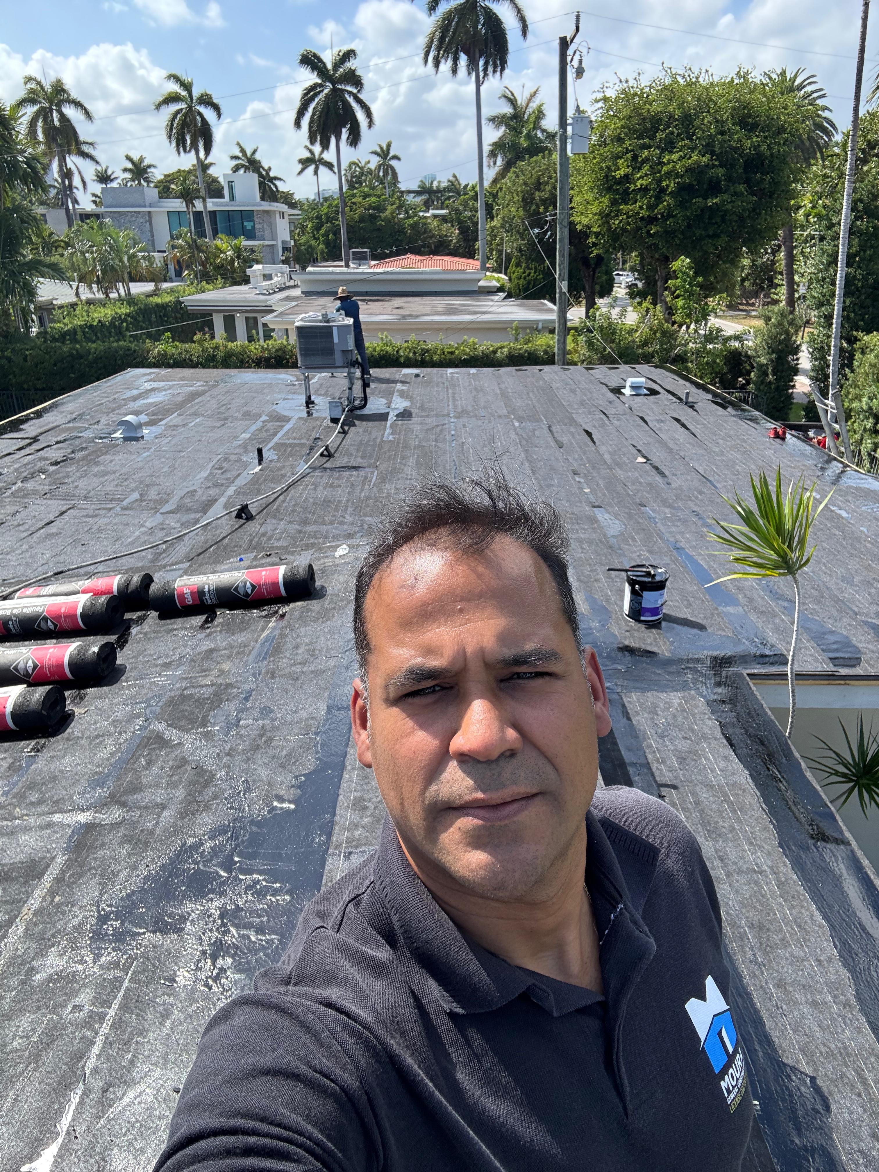 Renato on flat roof — modified bitumen installation