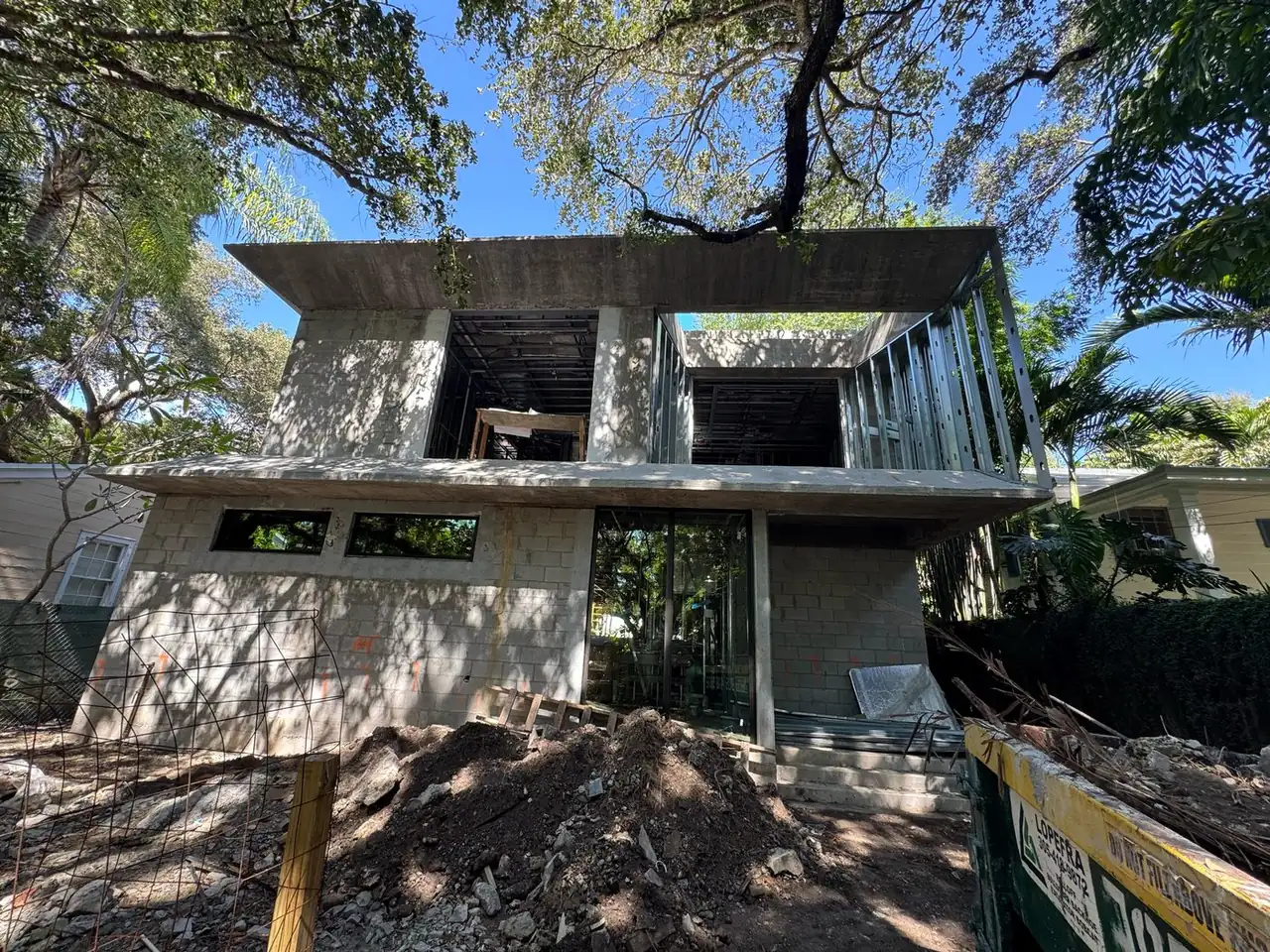 Two-story home under construction by Moura